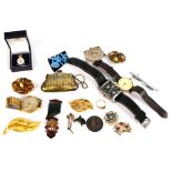 A small quantity of costume jewellery including a hardstone brooch, other brooches a bracelet,