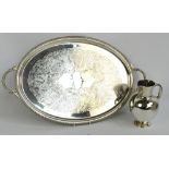 A large electroplated oval twin handled tray engraved with floral and ornamental motifs to the