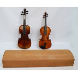 A three quarter sized German violin with two-piece back, length 34cm, cased with a bow,
