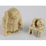 A Japanese Meiji period carved ivory netsuke modelled as a gentleman holding a staff and a basket,