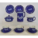 A Wedgwood and Caperns Ltd blue dip jasperware tea service comprising three trios (two cups af),