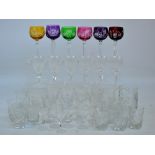 A quantity of various clear cut glass drinking glasses including a set of six wine glasses and a