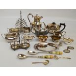 A group of electroplated items to include a teapot with matching sugar bowl and cream jug,