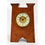 An oak Arts and Crafts mantel clock,