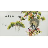 A 20th century Chinese embroidery on silk, a couple of peacocks perched on blossoming pine branch,