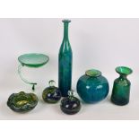 A collection of Mdina glass in blue and green sea colours including a pair of handled paperweights,