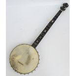 An early 20th century banjo by T.W. Bacon, 26 Endell Streeet, London, cased.