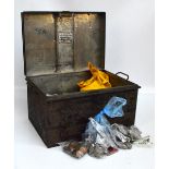 A tin trunk containing a large quantity of coins, predominantly presentation packs,