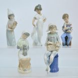 Four Nao porcelain figures comprising a girl dancing, a harlequin with a cat,