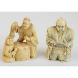 A Japanese Meiji period carved ivory netsuke of two figures beside a barrel drum, height 5.