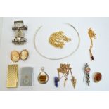 A small group of costume jewellery including a gold plated mounted oval cameo brooch,