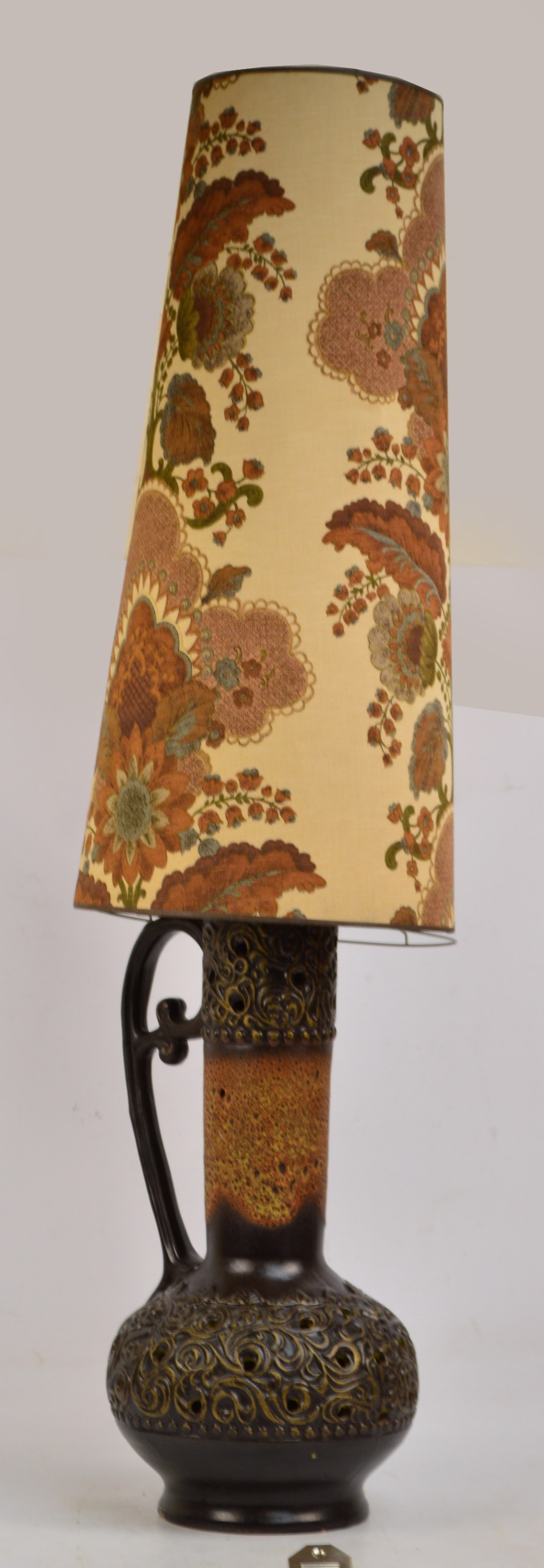 A large 1970s West German lamp in the form of a handled ewer, with pierced belied bottom,