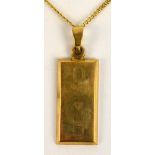 An Elizabeth II 9ct yellow gold rectangular ingot pendant commemorating Nelson,