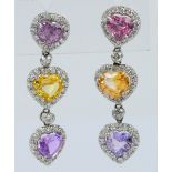 A pair of white metal diamond pink, yellow and pale lilac sapphire drop earrings,