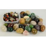 A large collection of various stones to include variously coloured quartz and tiger's eye,