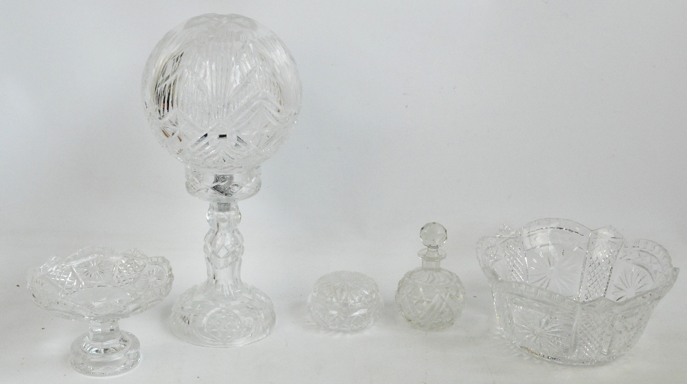 A group of clear cut glass items including a lamp, comport, large bowl,