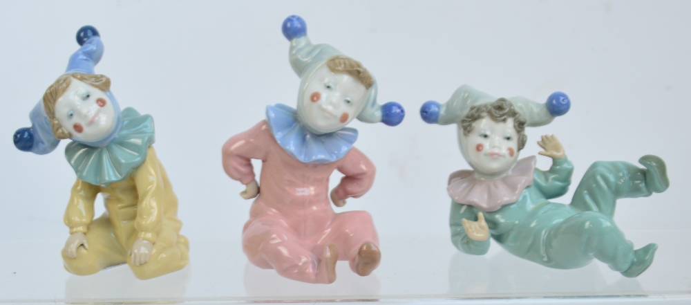 Three Nao figures of jesters in various poses (3).