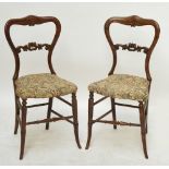 A mahogany button upholstered spoon back elbow chair with cabriole legs.
