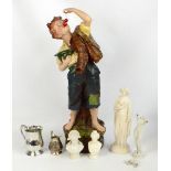Four Parian porcelain figures, a woman holding fruit, height 33cm, busts of Napoleon and Josephine,