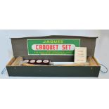 A boxed 1970s Jaques croquet set, with "How to play, the basic laws" leaflet.