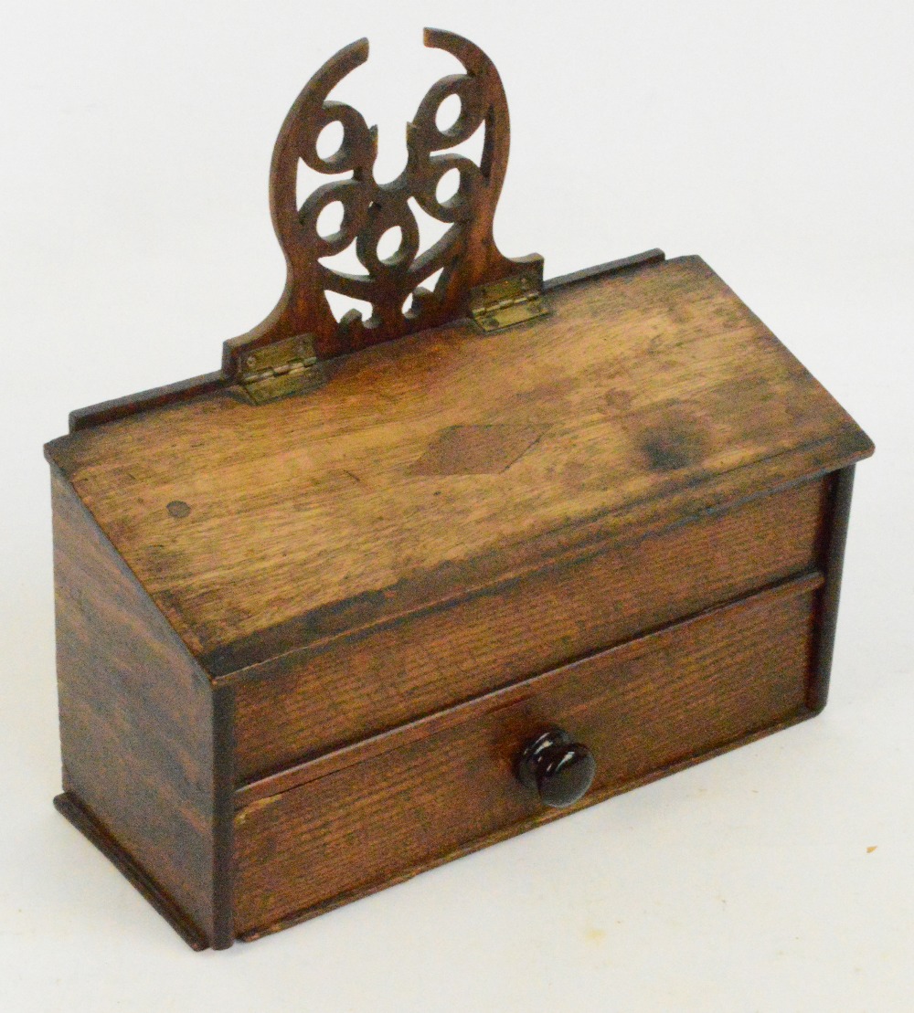 A Georgian oak salt box with sloping hinged lid above single drawer and with pierced wall mounts