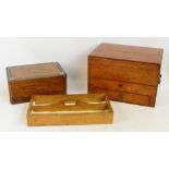 An Edwardian oak stationery box with hinged lid enclosing fitted interior above a single frieze