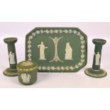 A 19th century Wedgwood green dip jasperware four piece dressing table set comprising a pair of