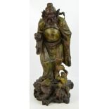 A large Japanese Meiji period carved rootwood figure of male deity/warrior with his robe,