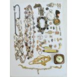 A small group of costume jewellery including a white metal Art Nouveau style brooch, a bracelet,