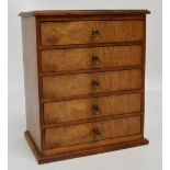 A contemporary walnut five drawer miniature chest by Richard Gravestock on moulded plinth base,