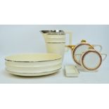 A French terre de fer (ironstone) Choisy Le Roi Art Deco style washing jug and bowl in cream with