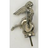 An Art Deco chromed metal car mascot modelled as a winged naked woman holding a wheel,