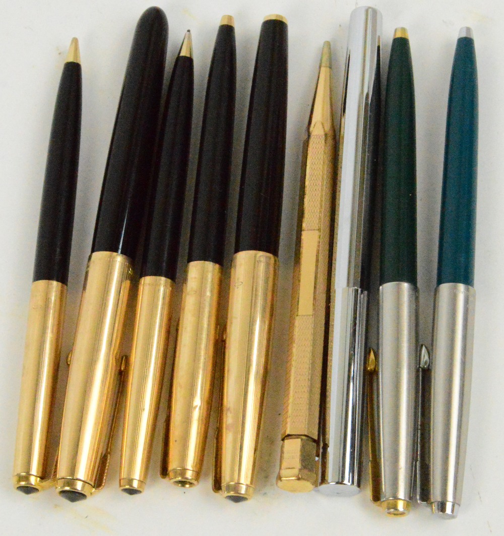 Two Parker fountain pens with gold rolled caps, two matching propelling pencils and a ballpoint pen,