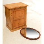 A small pine cupboard and an oval oak wall mirror (2).