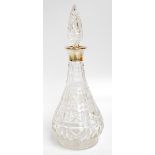 A George VI hallmarked silver collared clear cut glass decanter of slender baluster form,