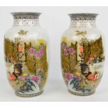 An opposing pair of Chinese Republic period porcelain vases of baluster form with flared rims,