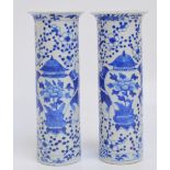 A pair of 19th century Chinese porcelain sleeve vases, painted in underglaze with two pairs of boys,