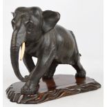 A large Japanese Meiji period bronze model of an elephant,