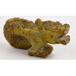 A Chinese russet included jade carving of a dragon-fish, length 7.5 cm.