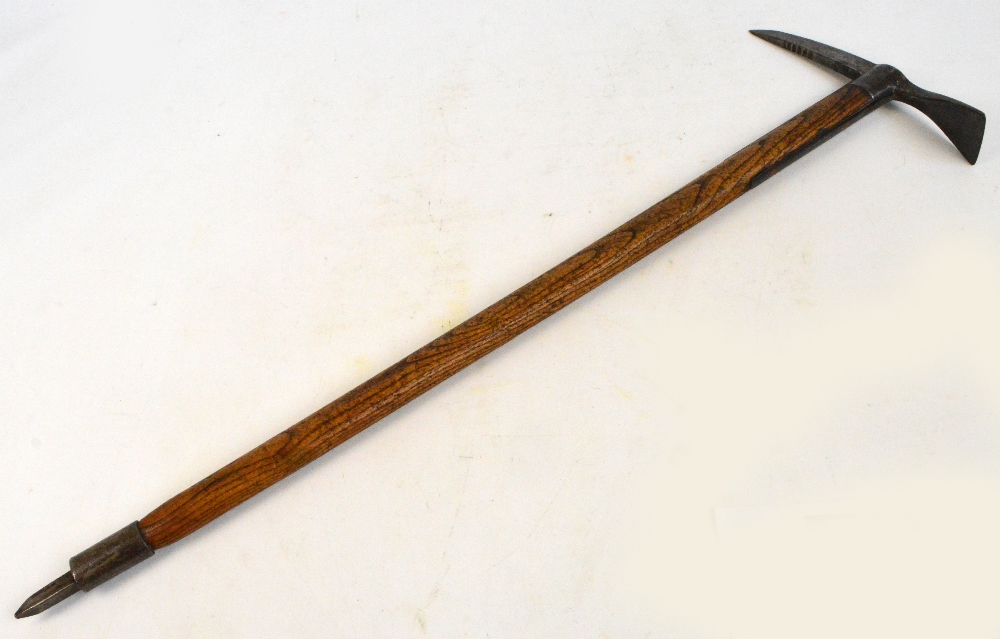 A vintage pick with wooden shaft and spike base, spike and blade upper section stamped "J.M.