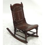 An early 20th century child's rocking chair.