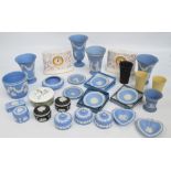 A collection of Wedgwood blue jasperware to include vases, pin dishes, trinket boxes, a flower pot,
