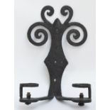 A wrought iron wall mounted two sectioned light with scrolling back plate, length 33cm.