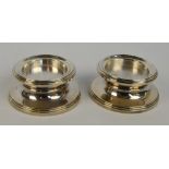 A pair of Elizabeth II Golden Jubilee hallmarked silver candle holders of circular form on