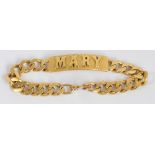 An 18ct yellow gold curb link identity bracelet centred with a rectangular plaque with applied name