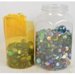 A large quantity of various glass marbles.