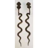 An opposing pair of Eastern brass and black enamel decorated wall sconces modelled as cobras,