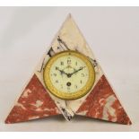 A French Art Deco marble triangular shaped mantel clock with circular dial set with Arabic numerals