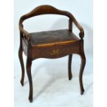 A 20th century beech leather upholstered piano stool with low back and scrolling front,