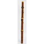 A 19th century boxwood and ivory mounted flute by Goulding, Covent Garden, London, length 60cm.